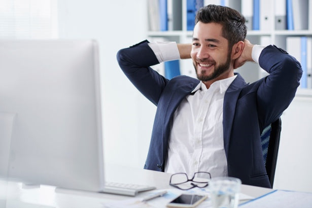 man with good posture in an office desk